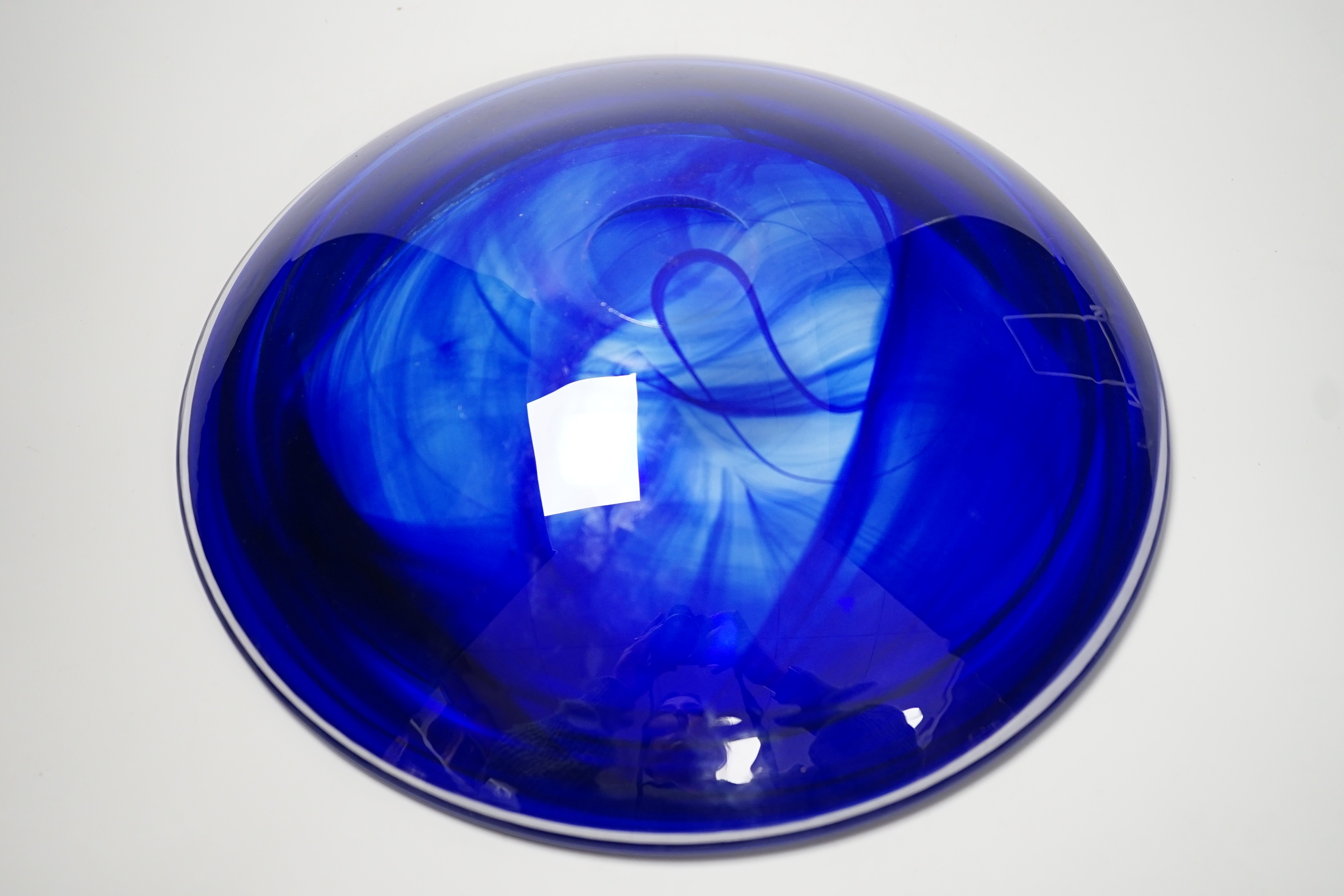 A Kosta Boda blue studio glass bowl by Anna Ehrner, 31cm diameter